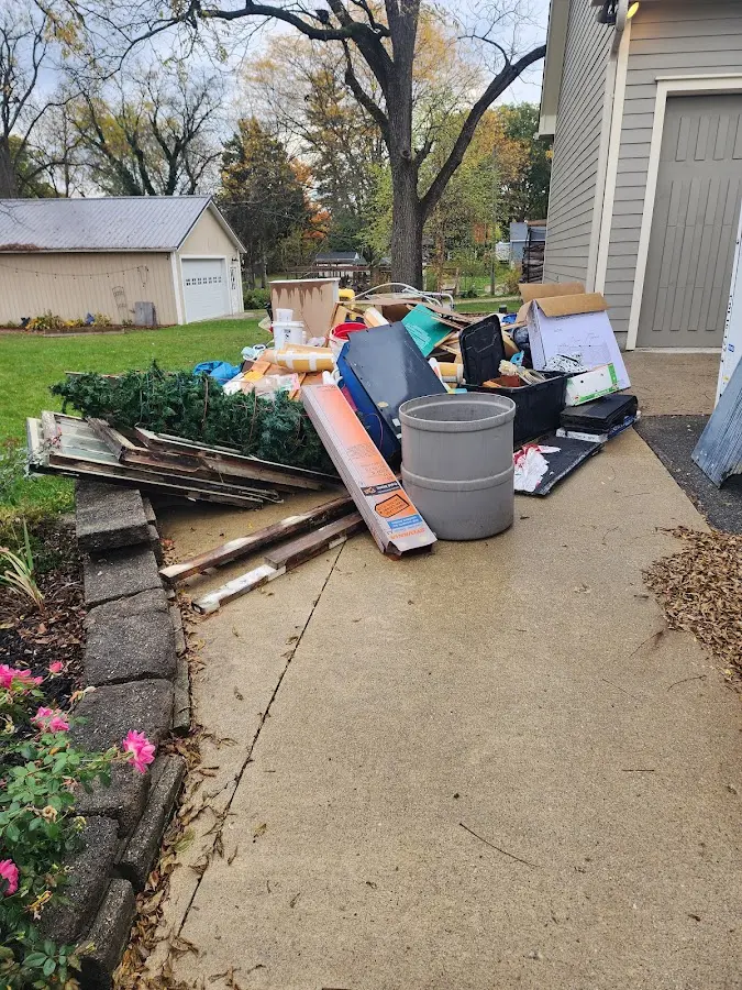 Dumpster being loaded with debris for 3 Yard Dumpster Rental in Lexington